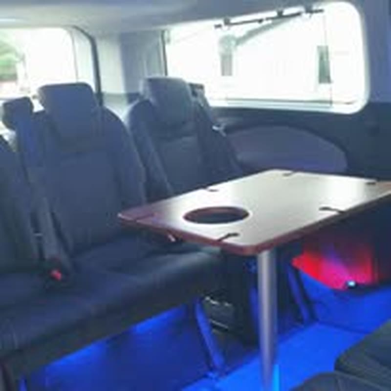 Minibus interior with table and leather seats
